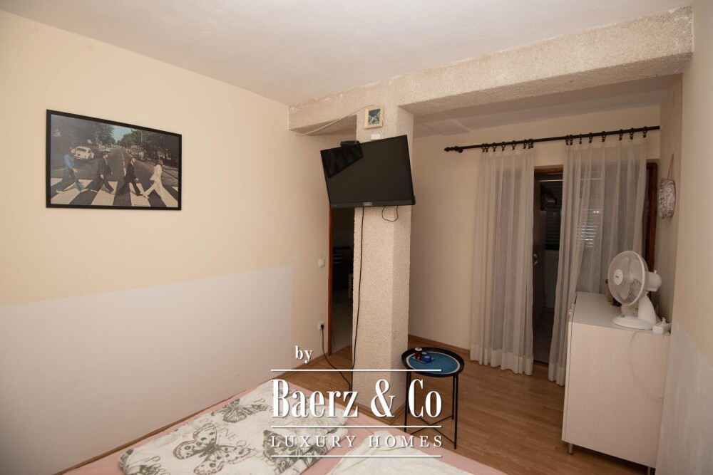 Tisno, exclusive seafront apartment house with panoramic sea views and a boat image
