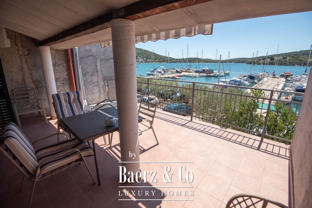 Tisno, exclusive seafront apartment house with panoramic sea views and a boat image