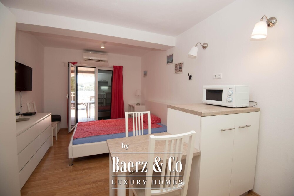 Tisno, exclusive seafront apartment house with panoramic sea views and a boat image