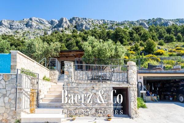 photo 24 Omiš, Stanići, a beautiful house with a sea view, total living area of 160 m² on a land plot of 2546